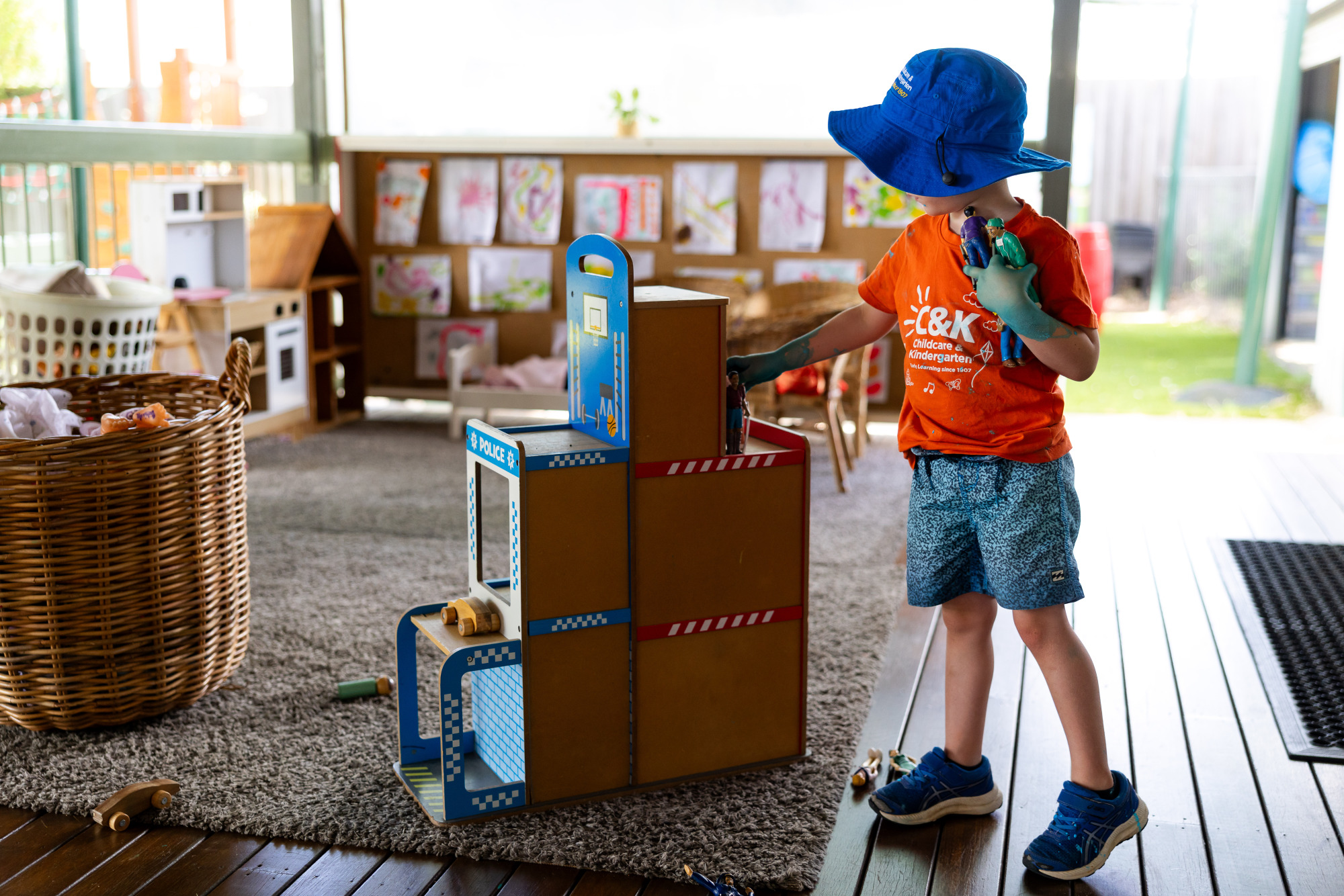 C&K Cambooya - child playing in undercover outdoor veranda