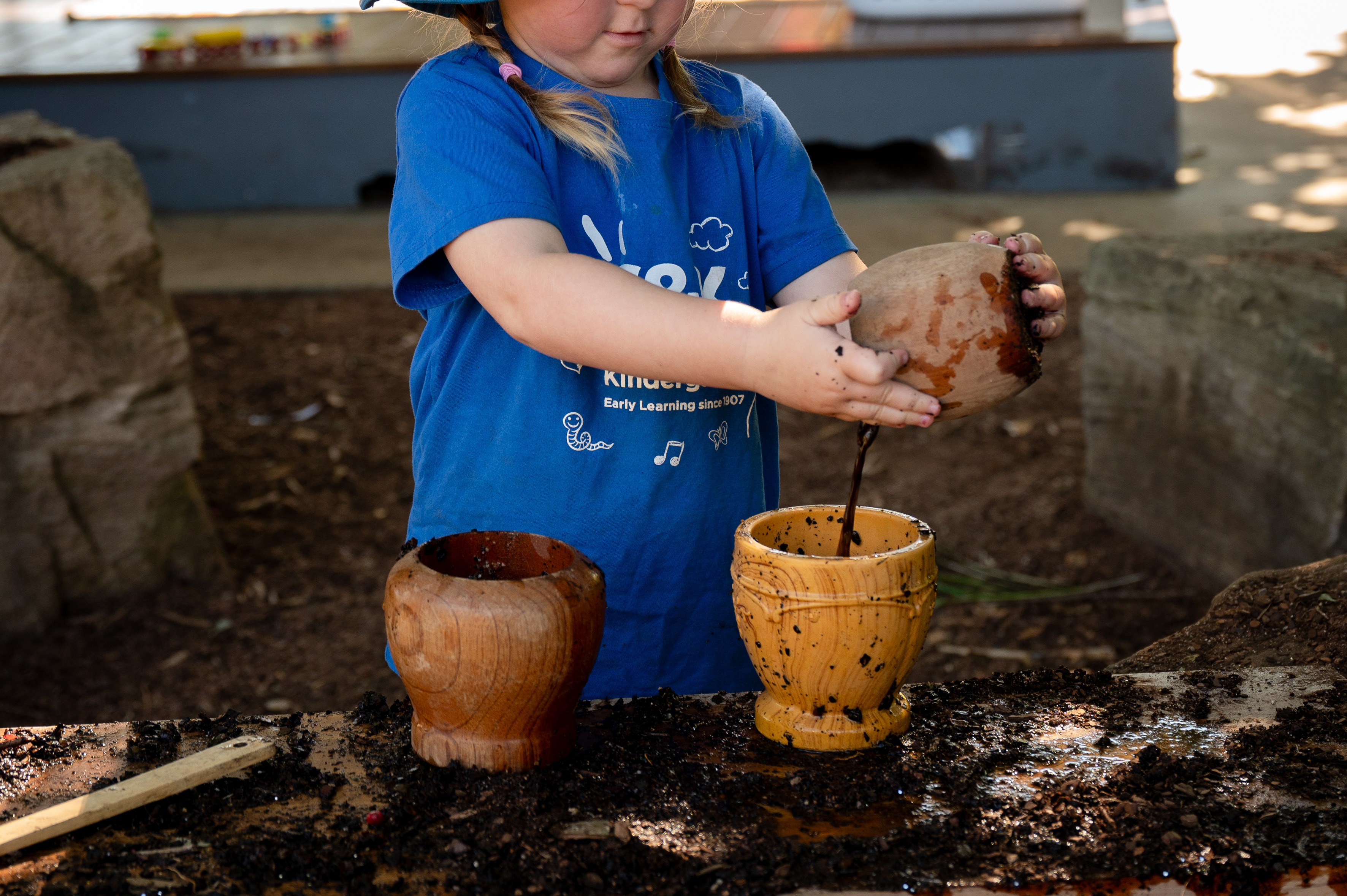 C&K Marian - child playing in the mud kitchen