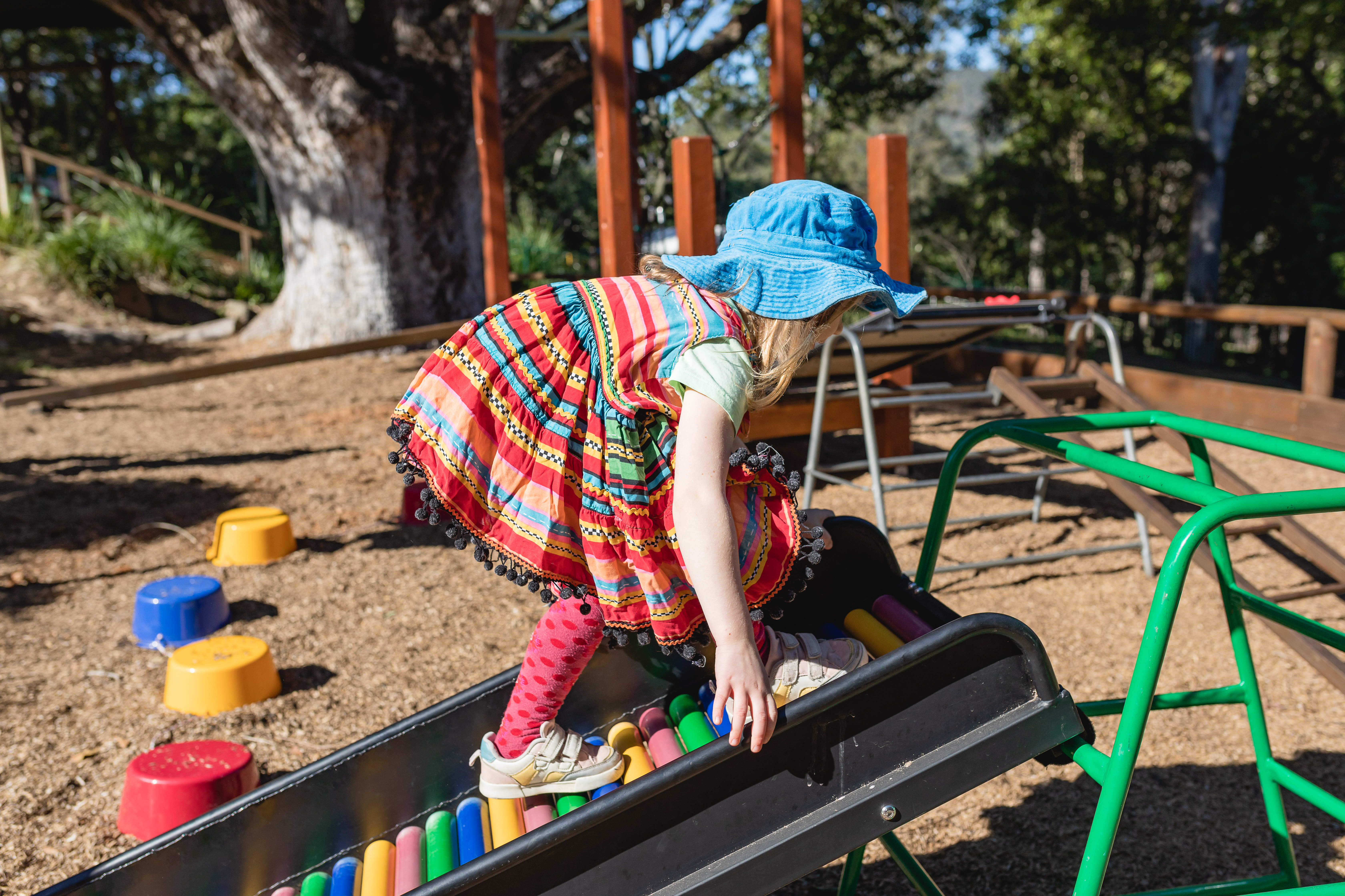 C&K The Gap - child climbing the obstacle course outside