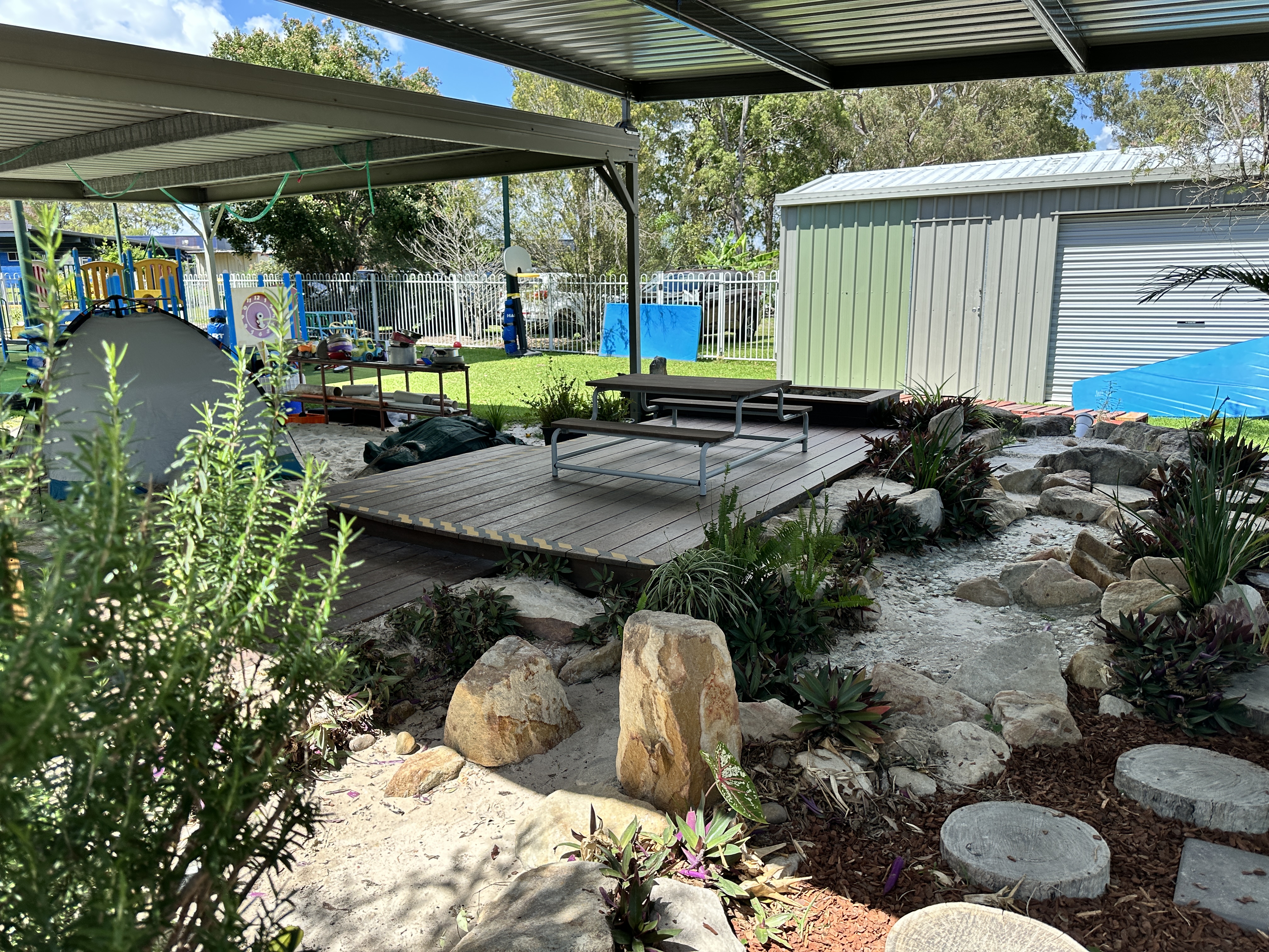 Large natural outdoor space with rocks and greenery