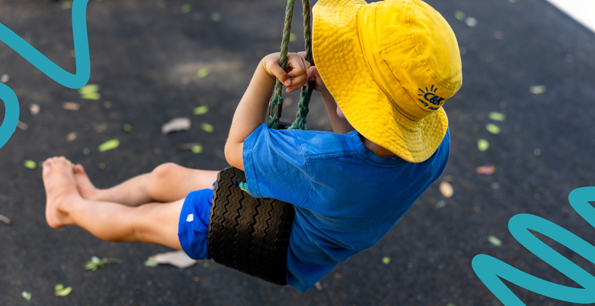 Kindergarten child on a swing