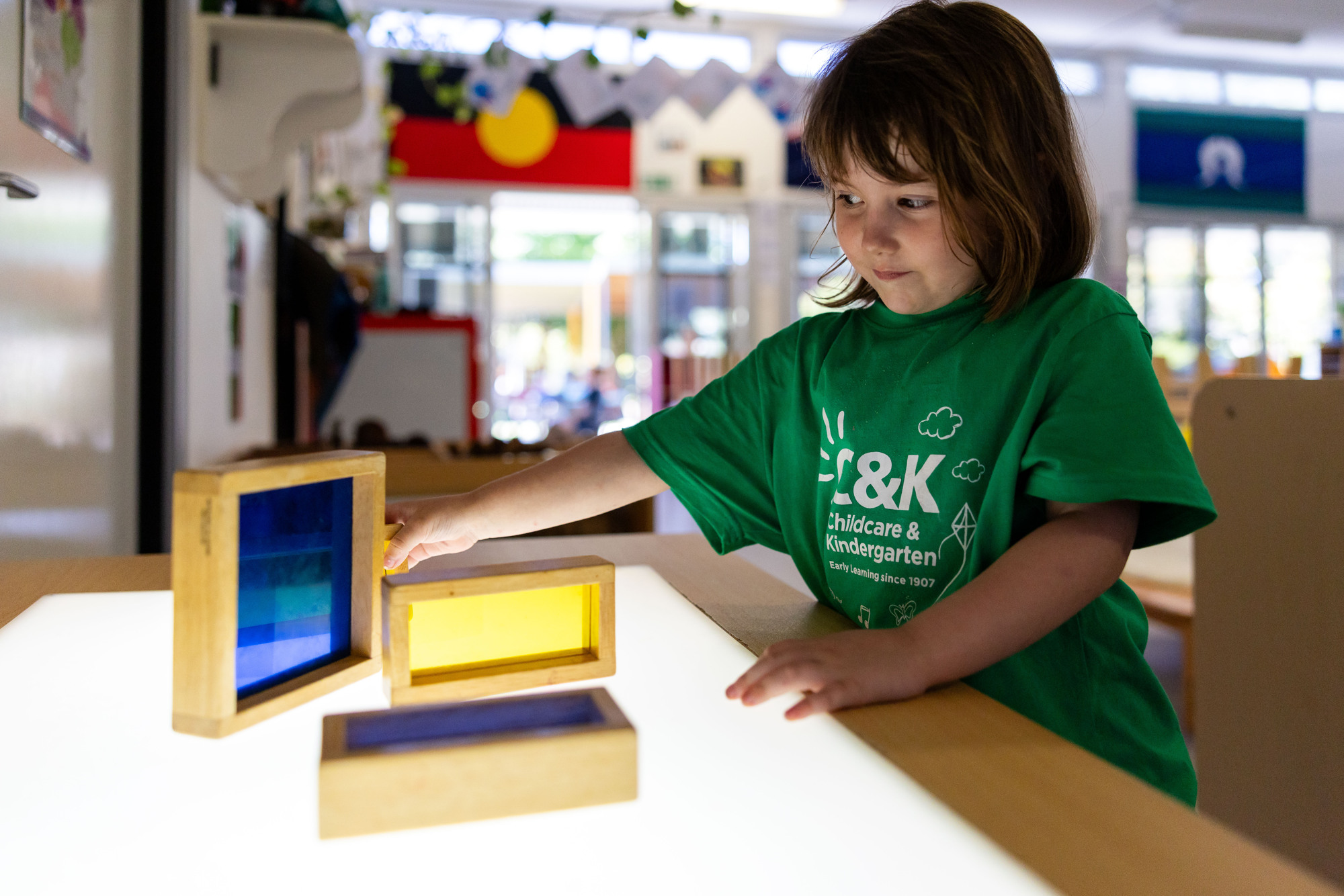 C&K Eagleby South - child playing with coloured blocks