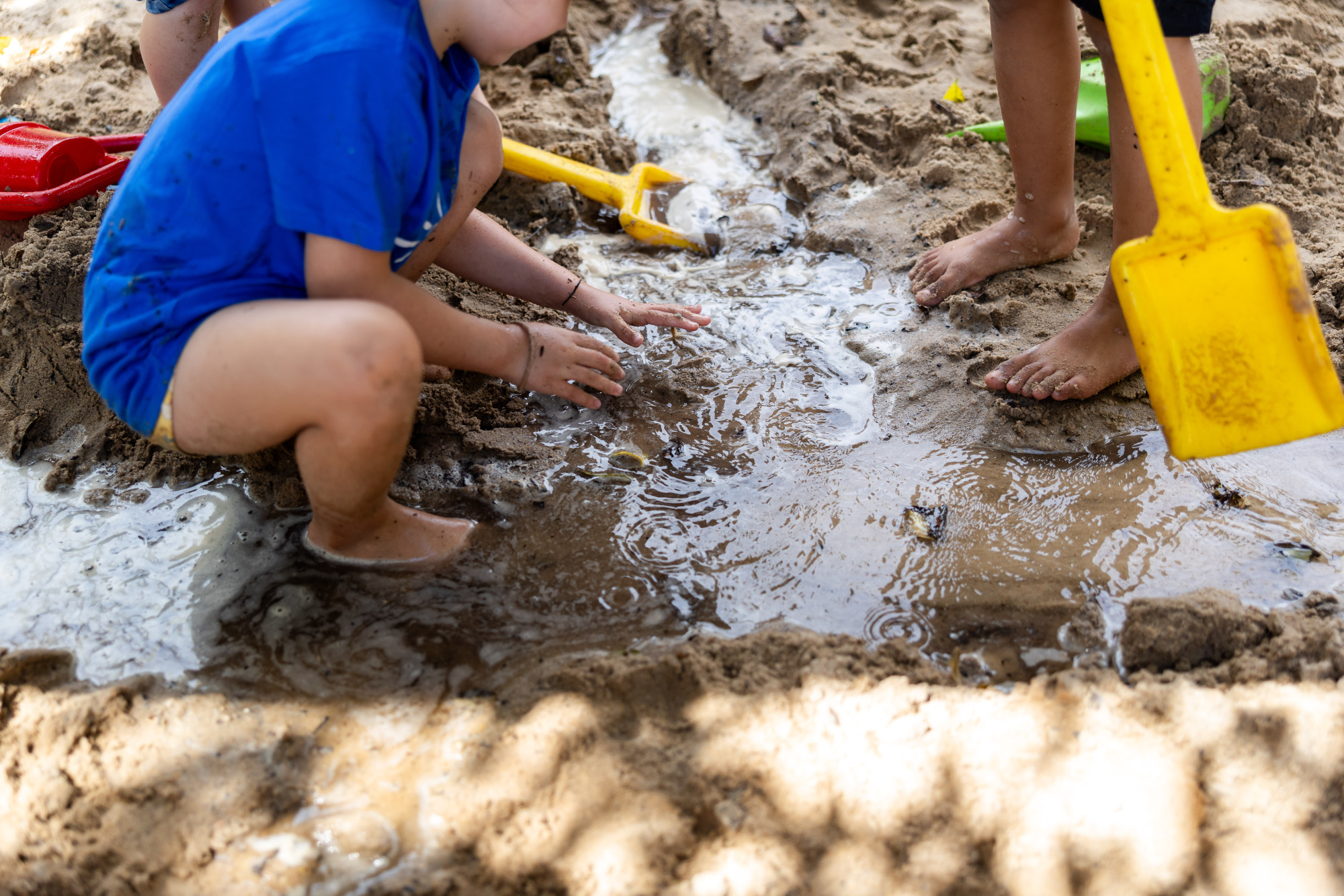 C&K Caboolture - children playing with water in the sandpit