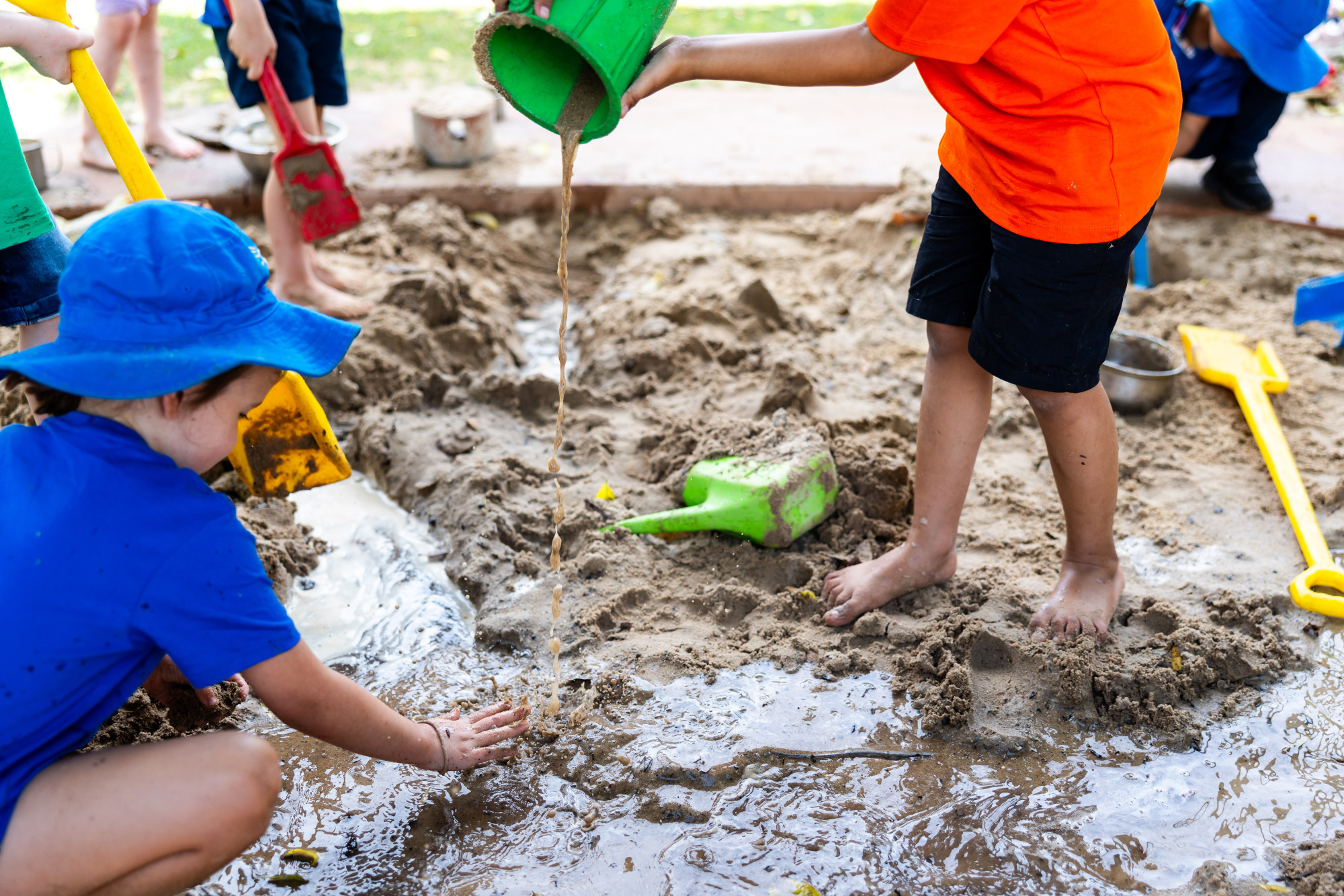 C&K Gabbinbar - children playing with water in the sandpit