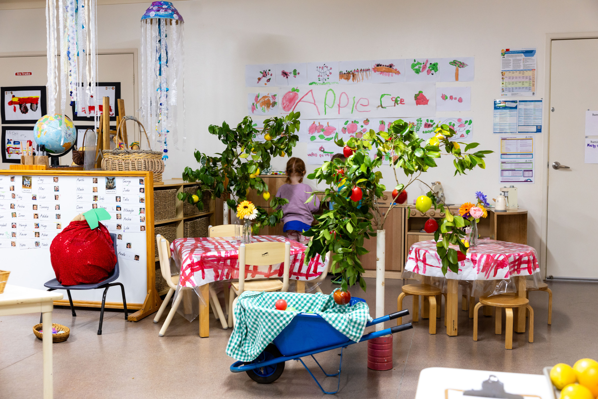 Highfields & District Kindergarten - child role playing in the cafe