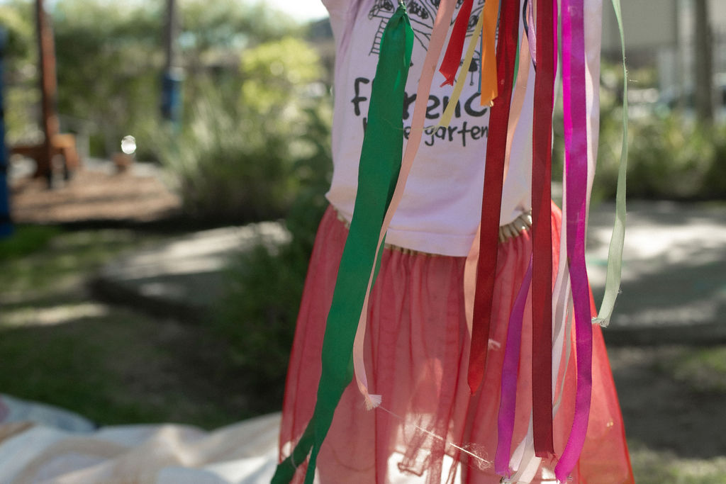 C&K Florence - child playing with ribbons