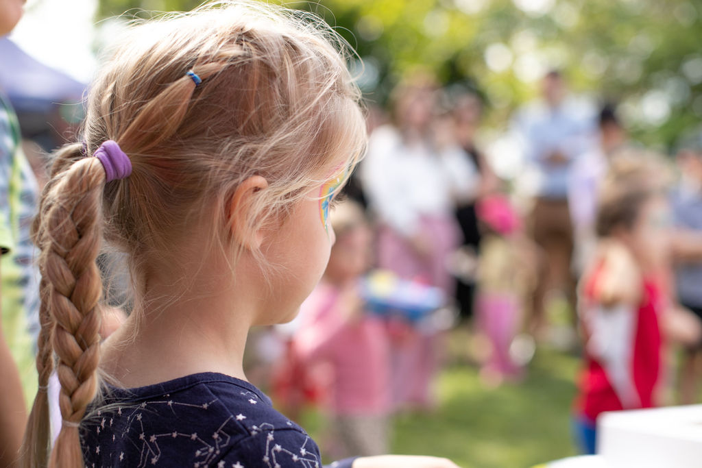 Girl with facepaint at a kindy event