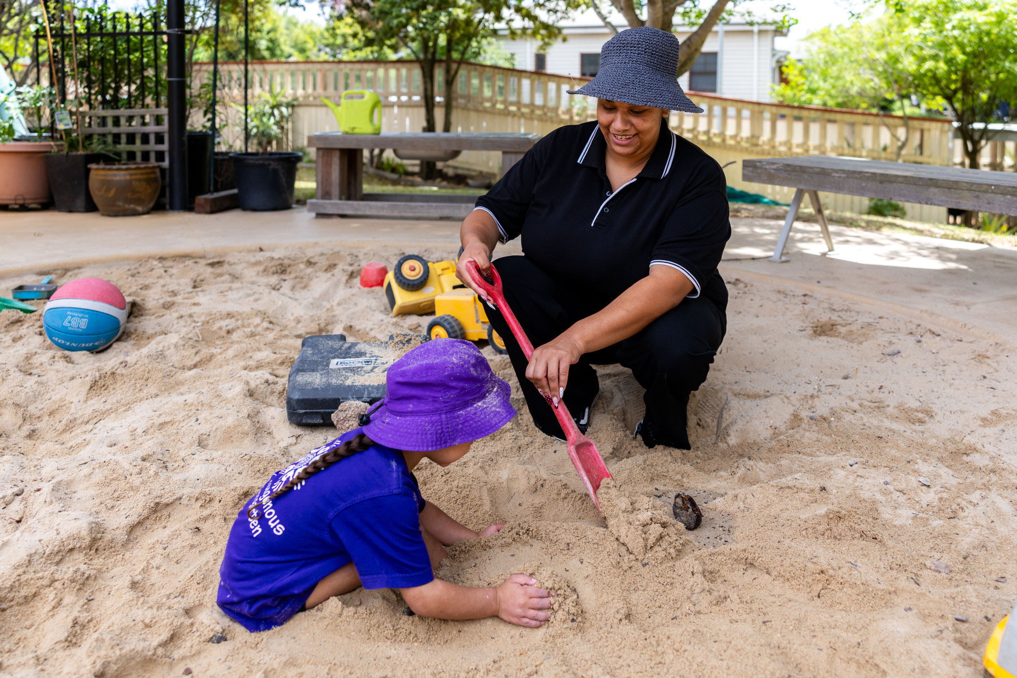 Kulila Indigenous Kindergarten - educator and child in sandpit