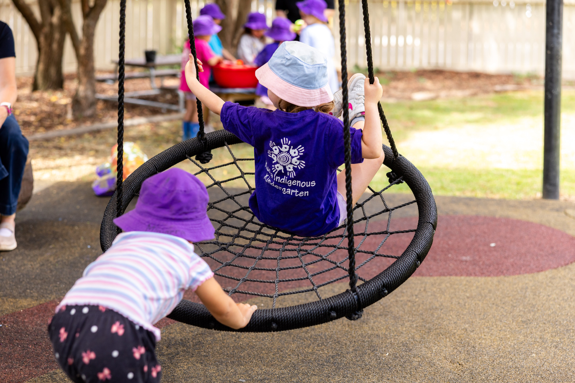Kulila Indigenous Kindergarten - children playing on a swing
