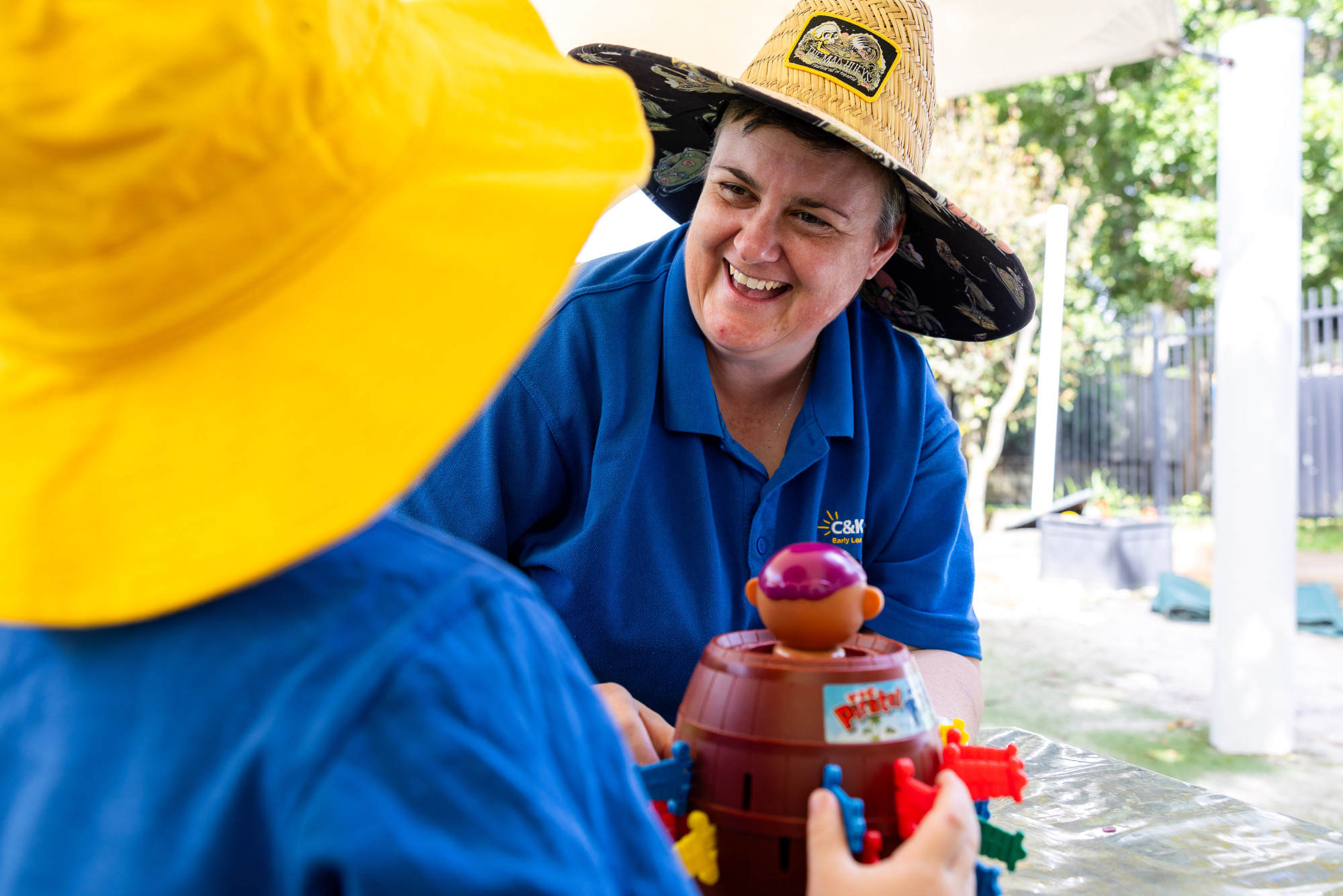 C&K Mt Gravatt West - educator and child playing a game