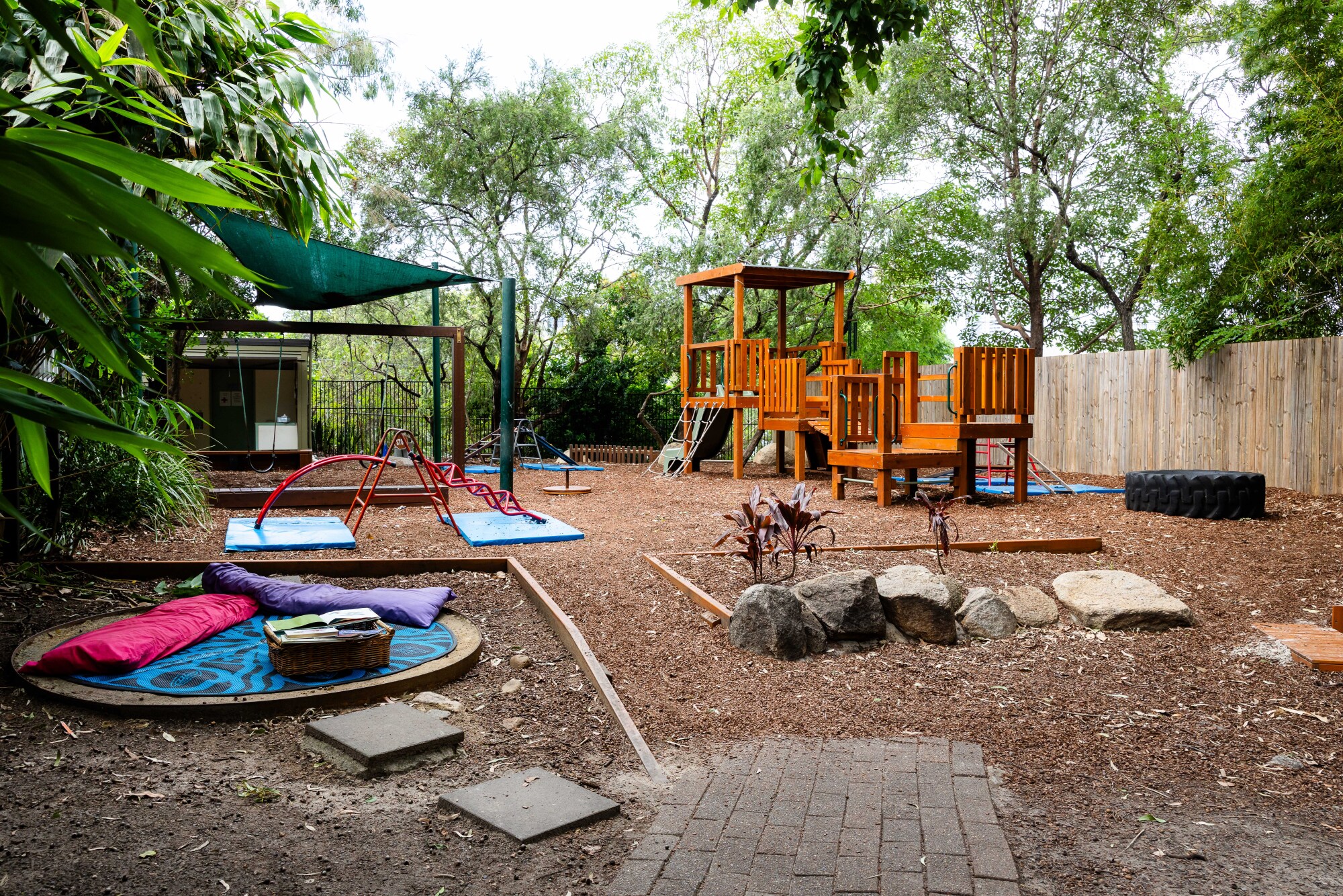 C&K Paddington - outdoor space including swings, playground fort and obstacle course
