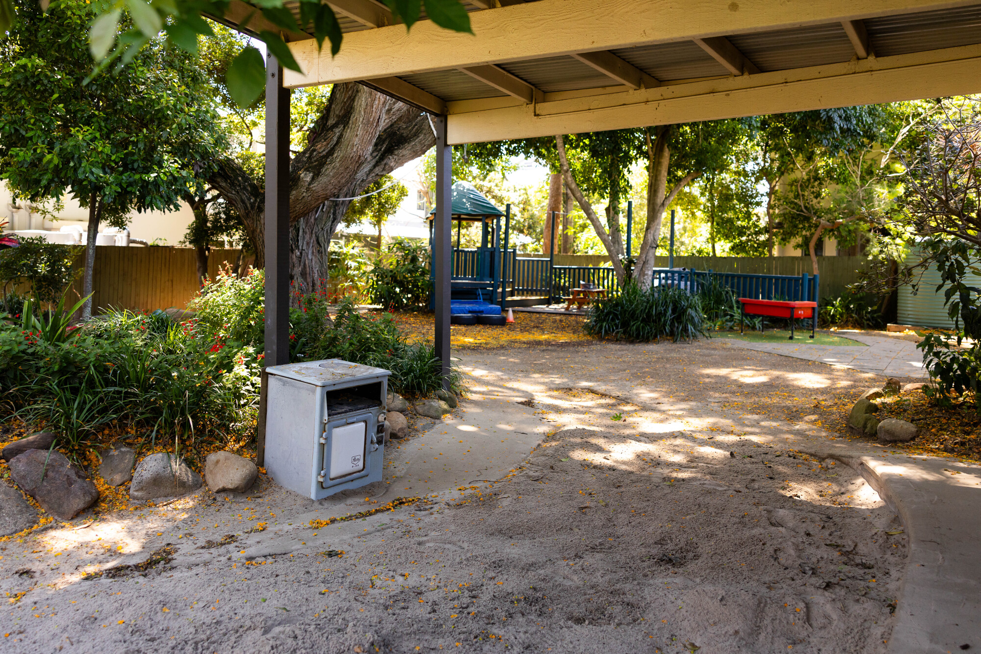 C&K Redlands - outdoor space with sandpit and play kitchen