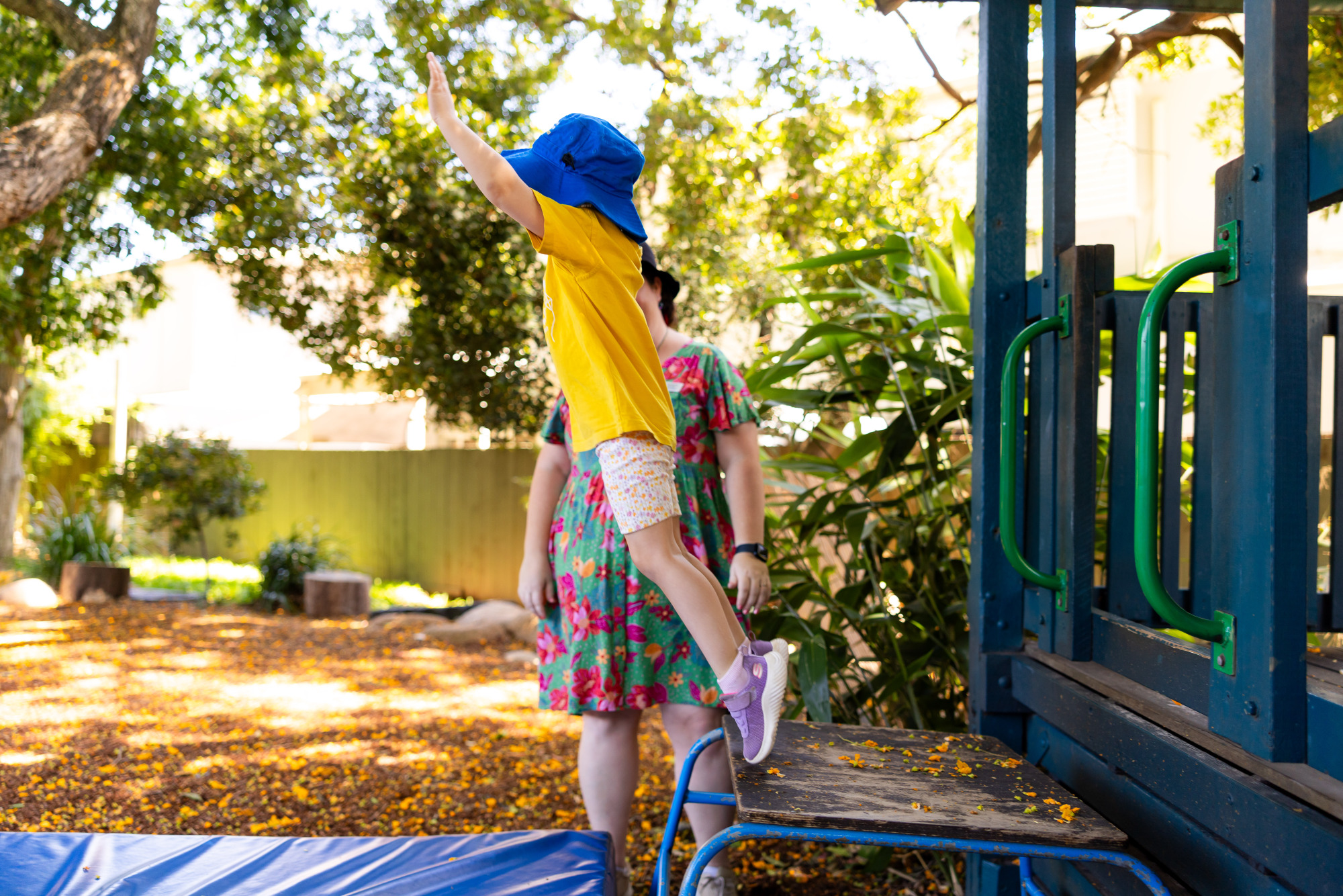 C&K Redlands - child jumping from playground to crash mat