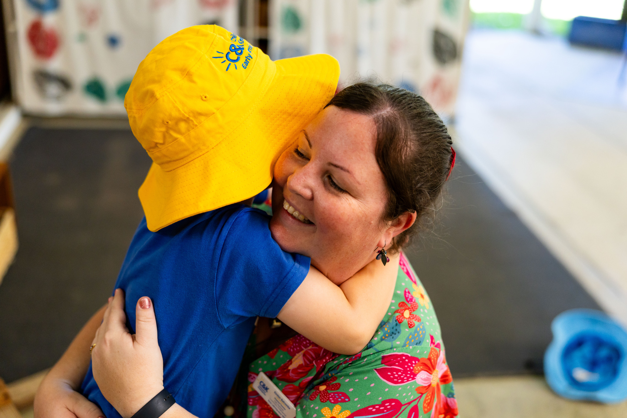 C&K Redlands - child and educator hugging