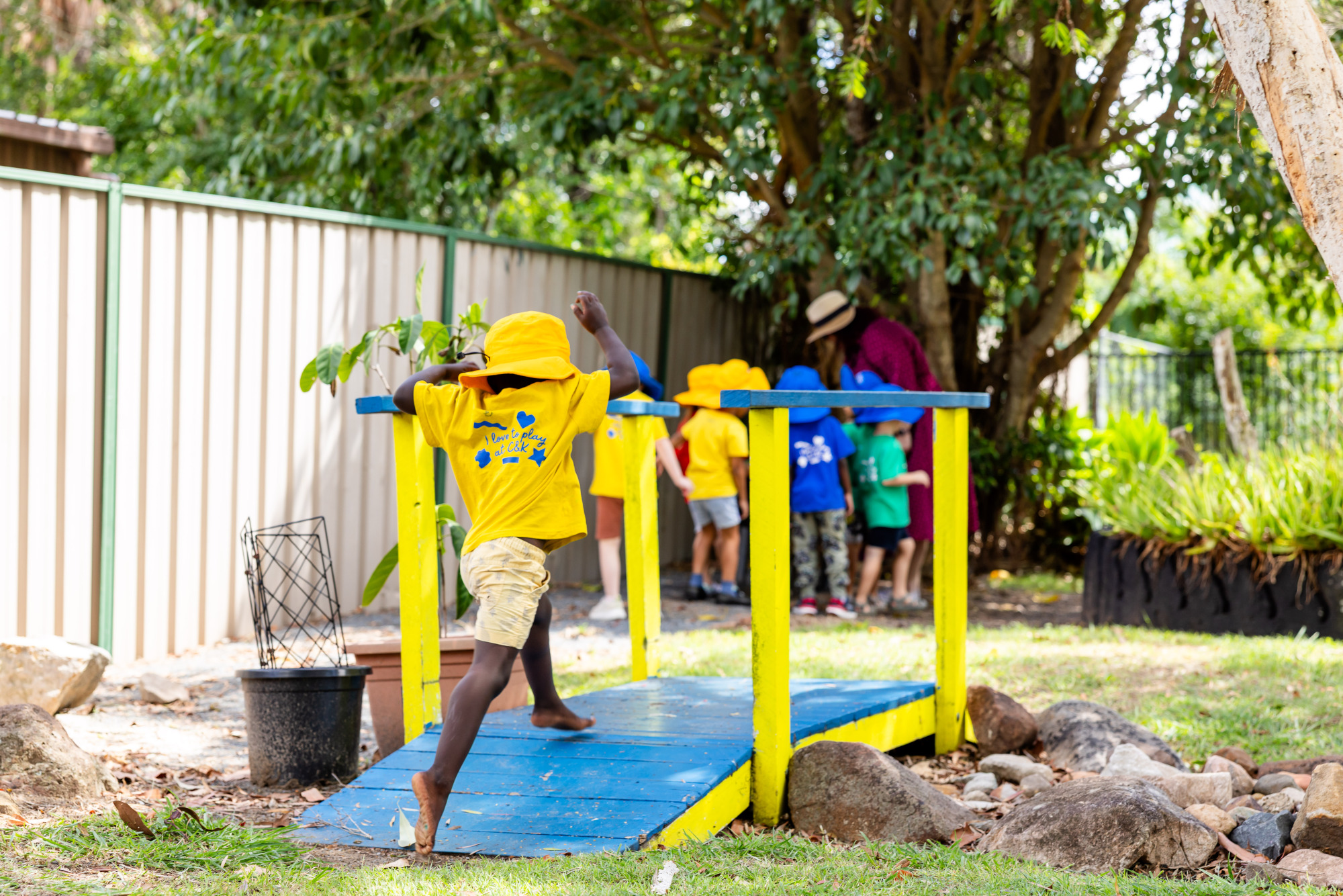 C&K Redbank Plains - child running across a bridge outdoors
