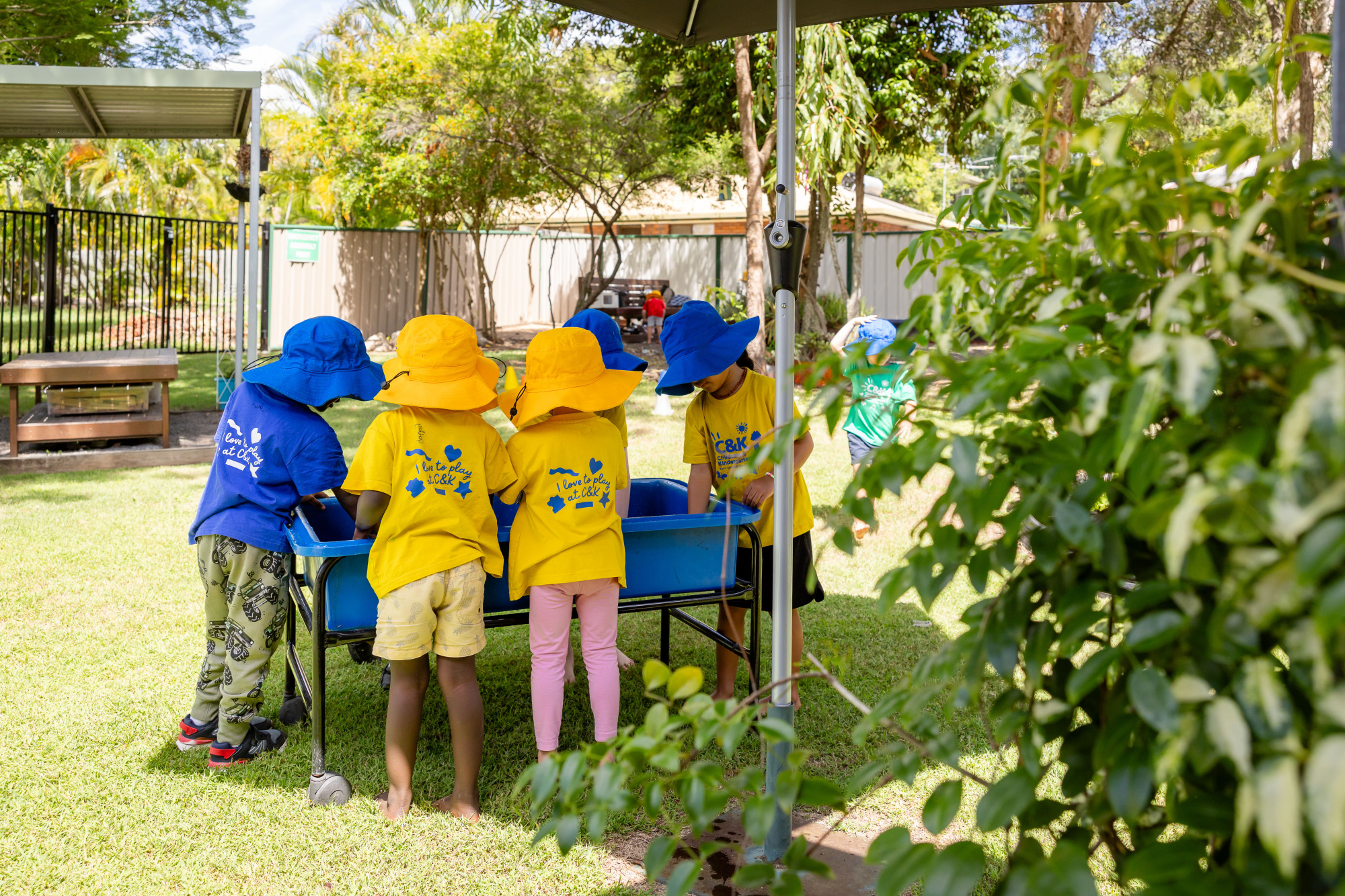 C&K Redbank Plains - children playing at a water table outside