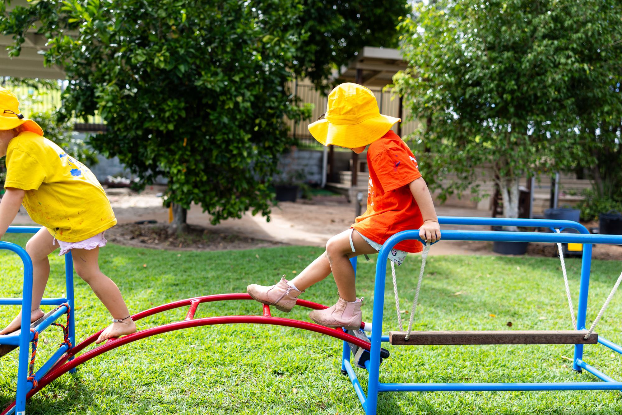C&K Woodhill - child climbing across frames on an obstacle course