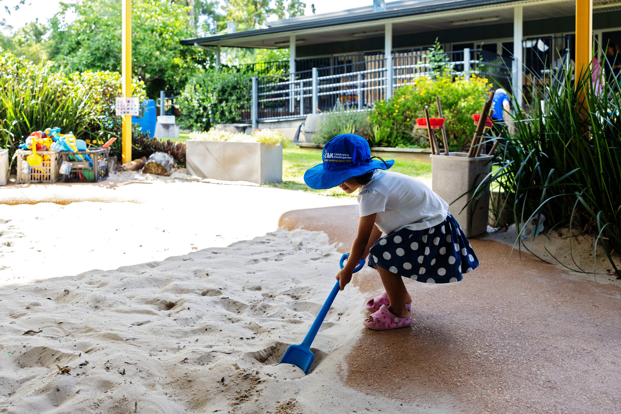 Child digging in large sandpit