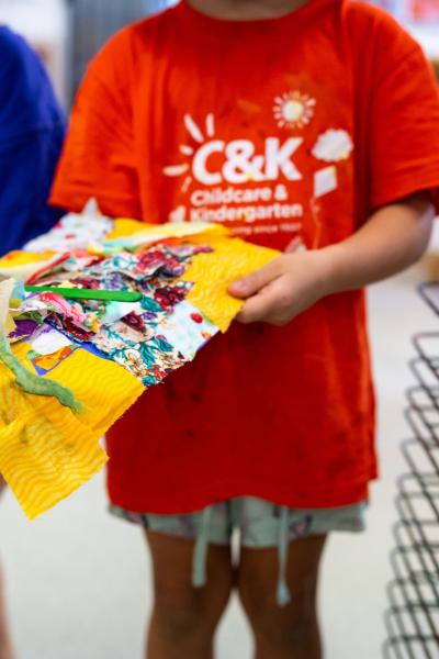 Child holding artwork