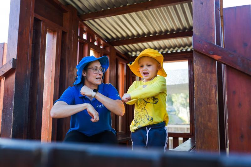 Educator and child playing