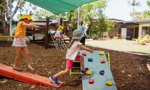 C&K kindy children balancing and playing outside