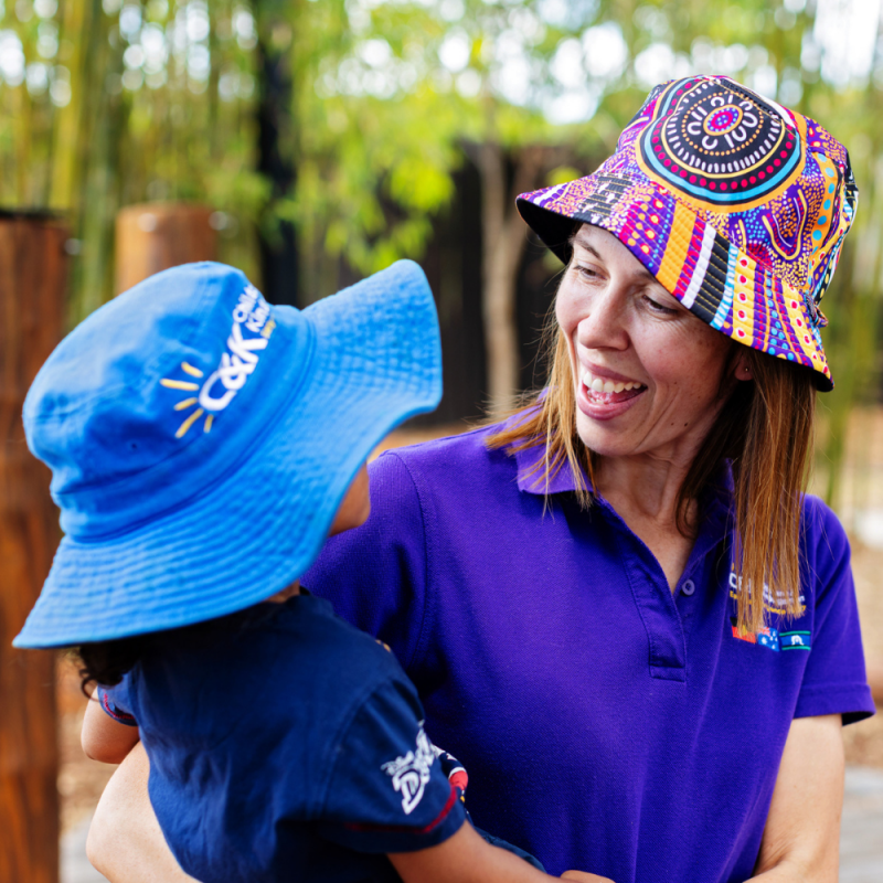 Home page slider 2 - educator smiling at child