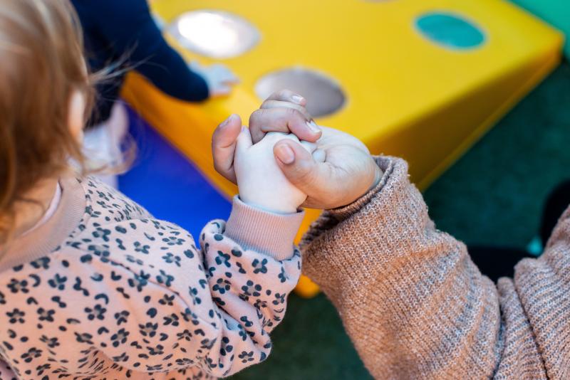 Toddlers handing hands a C&K childcare centre