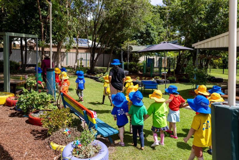 Kindy teacher with kindy friends outside