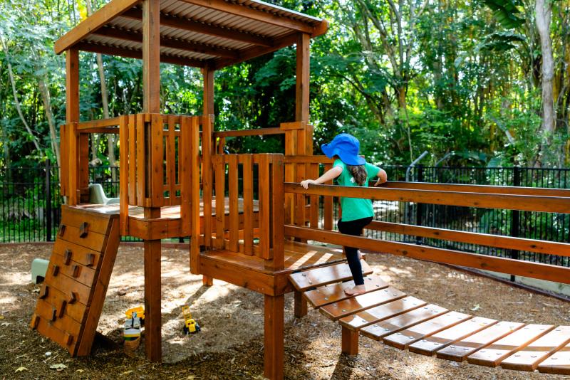 Child playing on fort outside