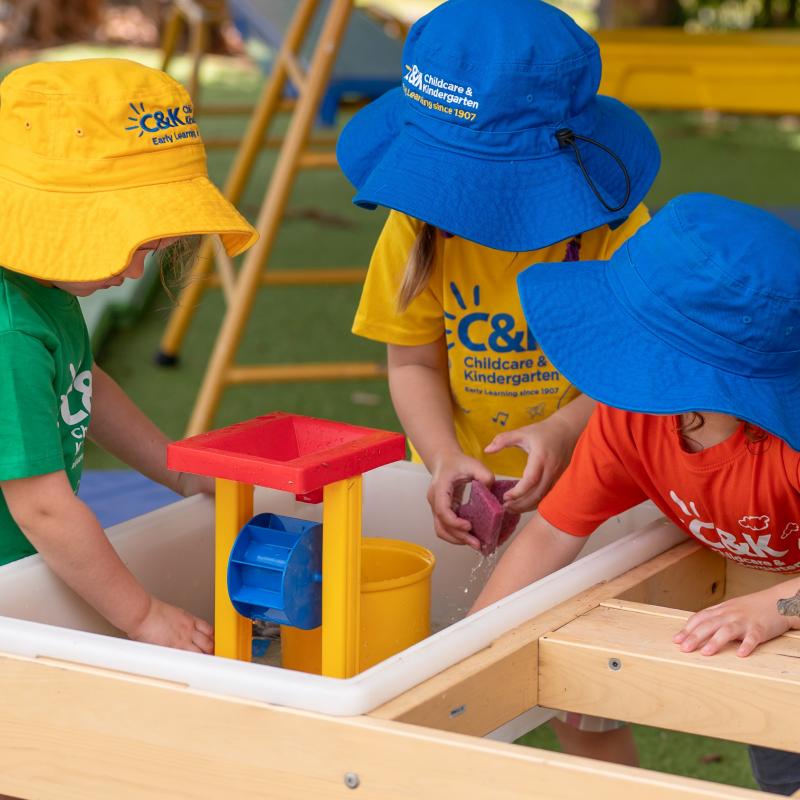 Children engaged in water play together